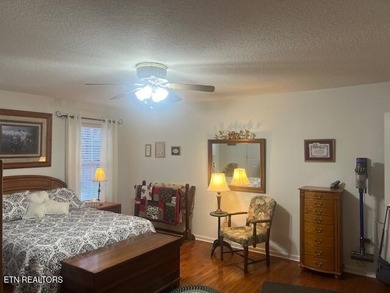 Discover this nicely maintained home on a combined double lot on Lake Tansi Village Country Club in Tennessee - for sale on GolfHomes.com, golf home, golf lot