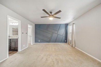 Tucked away in a well-established neighborhood and less than a on White Hawk Golf Club in Oklahoma - for sale on GolfHomes.com, golf home, golf lot