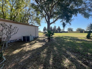 This 2/2 home will be offered fully furnished and it includes on Lake Henry Golf Club in Florida - for sale on GolfHomes.com, golf home, golf lot