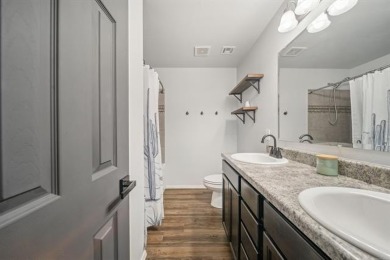 Tucked away in a well-established neighborhood and less than a on White Hawk Golf Club in Oklahoma - for sale on GolfHomes.com, golf home, golf lot