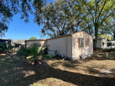 This 2/2 home will be offered fully furnished and it includes on Lake Henry Golf Club in Florida - for sale on GolfHomes.com, golf home, golf lot
