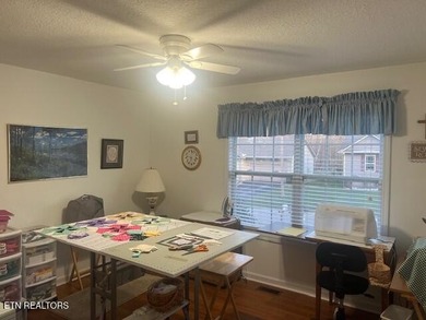 Discover this nicely maintained home on a combined double lot on Lake Tansi Village Country Club in Tennessee - for sale on GolfHomes.com, golf home, golf lot