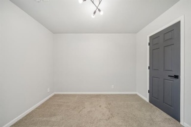 Tucked away in a well-established neighborhood and less than a on White Hawk Golf Club in Oklahoma - for sale on GolfHomes.com, golf home, golf lot