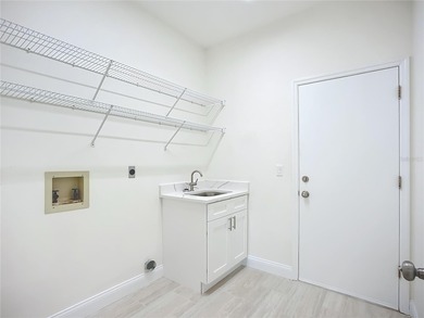 Absolute stunner and an exceptional value. This fully remodeled on The Meadows Golf and Country Club in Florida - for sale on GolfHomes.com, golf home, golf lot