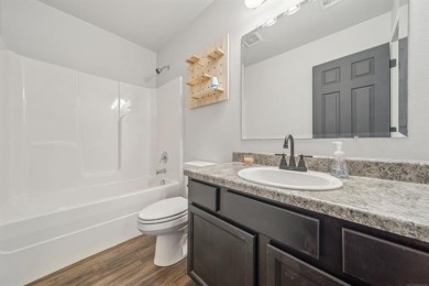 Tucked away in a well-established neighborhood and less than a on White Hawk Golf Club in Oklahoma - for sale on GolfHomes.com, golf home, golf lot