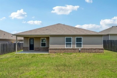 Tucked away in a well-established neighborhood and less than a on White Hawk Golf Club in Oklahoma - for sale on GolfHomes.com, golf home, golf lot