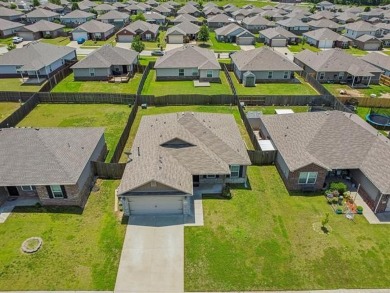Tucked away in a well-established neighborhood and less than a on White Hawk Golf Club in Oklahoma - for sale on GolfHomes.com, golf home, golf lot