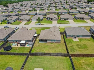 Tucked away in a well-established neighborhood and less than a on White Hawk Golf Club in Oklahoma - for sale on GolfHomes.com, golf home, golf lot