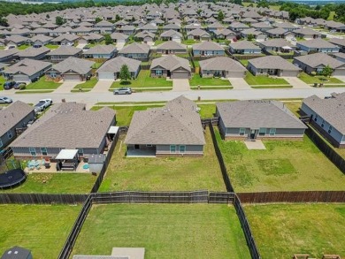 Tucked away in a well-established neighborhood and less than a on White Hawk Golf Club in Oklahoma - for sale on GolfHomes.com, golf home, golf lot