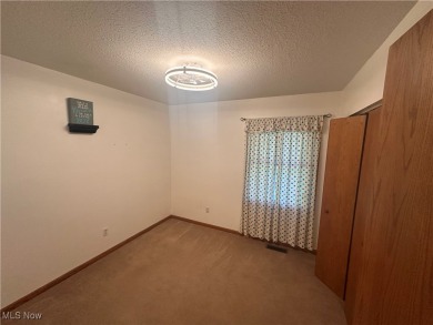 Spacious ranch home offering 3 bedrooms, 2 full baths, and an on Apple Valley Golf Course in Ohio - for sale on GolfHomes.com, golf home, golf lot