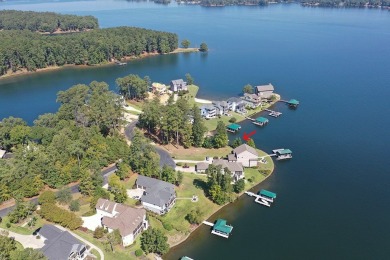 This is a prime waterfront property with long-range views and an on The Patriot Golf Club At Grand Harbor in South Carolina - for sale on GolfHomes.com, golf home, golf lot