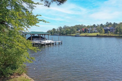 This is a prime waterfront property with long-range views and an on The Patriot Golf Club At Grand Harbor in South Carolina - for sale on GolfHomes.com, golf home, golf lot