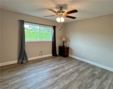 **WOW! A CORNER LOT*DBL GARAGE* AND AN EXTRA 2 SPACE PARKING on Cypress Lake Country Club in Florida - for sale on GolfHomes.com, golf home, golf lot