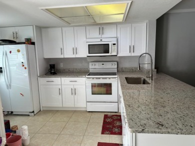Beautifully updated and move-in ready! This nicely kept on Village Golf Club in Florida - for sale on GolfHomes.com, golf home, golf lot