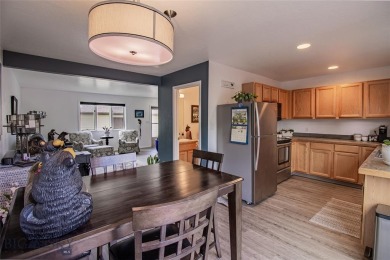 Welcome home to this low maintenance townhouse in Meadowlark on Butte Country Club in Montana - for sale on GolfHomes.com, golf home, golf lot