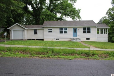 This beautifully renovated home has been completely gutted and on Benton Golf and Country Club in Kentucky - for sale on GolfHomes.com, golf home, golf lot