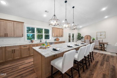 Enjoy one-level living in this beautifully crafted custom ranch on River Golf and Country Club at Lake Royale in North Carolina - for sale on GolfHomes.com, golf home, golf lot