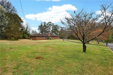 Nestled on one of the largest residential lots in the charming on College Park Municipal Golf Course in Georgia - for sale on GolfHomes.com, golf home, golf lot