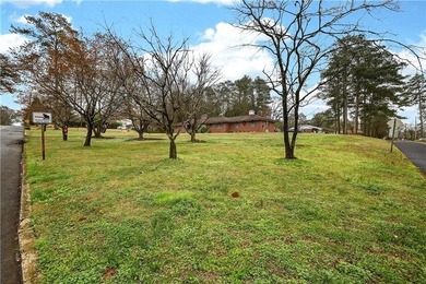 Nestled on one of the largest residential lots in the charming on College Park Municipal Golf Course in Georgia - for sale on GolfHomes.com, golf home, golf lot