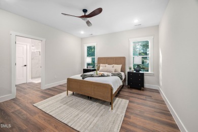 Enjoy one-level living in this beautifully crafted custom ranch on River Golf and Country Club at Lake Royale in North Carolina - for sale on GolfHomes.com, golf home, golf lot