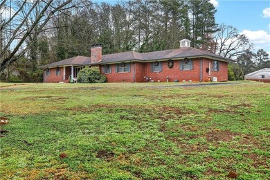 Nestled on one of the largest residential lots in the charming on College Park Municipal Golf Course in Georgia - for sale on GolfHomes.com, golf home, golf lot