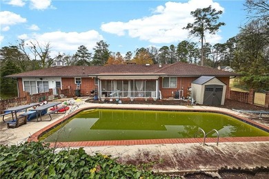 Nestled on one of the largest residential lots in the charming on College Park Municipal Golf Course in Georgia - for sale on GolfHomes.com, golf home, golf lot