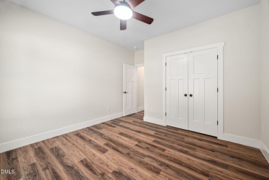 Enjoy one-level living in this beautifully crafted custom ranch on River Golf and Country Club at Lake Royale in North Carolina - for sale on GolfHomes.com, golf home, golf lot