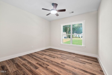 Enjoy one-level living in this beautifully crafted custom ranch on River Golf and Country Club at Lake Royale in North Carolina - for sale on GolfHomes.com, golf home, golf lot