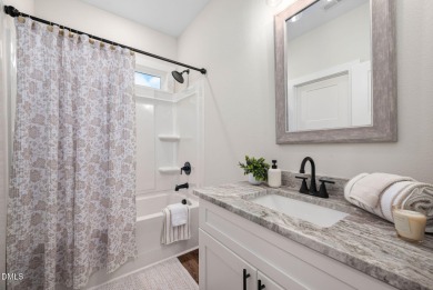 Enjoy one-level living in this beautifully crafted custom ranch on River Golf and Country Club at Lake Royale in North Carolina - for sale on GolfHomes.com, golf home, golf lot