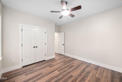 Enjoy one-level living in this beautifully crafted custom ranch on River Golf and Country Club at Lake Royale in North Carolina - for sale on GolfHomes.com, golf home, golf lot