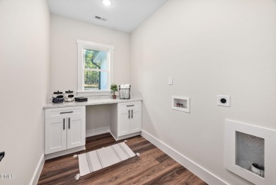 Enjoy one-level living in this beautifully crafted custom ranch on River Golf and Country Club at Lake Royale in North Carolina - for sale on GolfHomes.com, golf home, golf lot