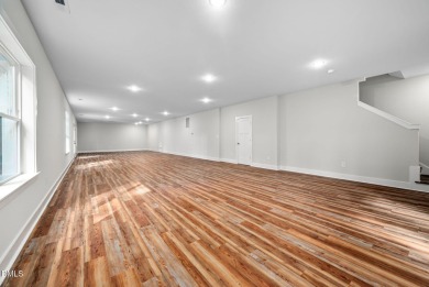 Enjoy one-level living in this beautifully crafted custom ranch on River Golf and Country Club at Lake Royale in North Carolina - for sale on GolfHomes.com, golf home, golf lot