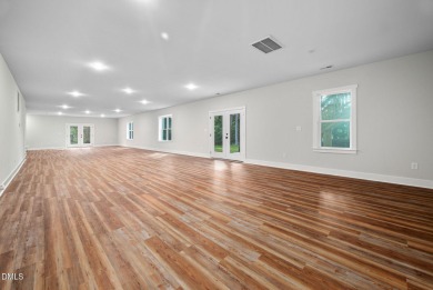Enjoy one-level living in this beautifully crafted custom ranch on River Golf and Country Club at Lake Royale in North Carolina - for sale on GolfHomes.com, golf home, golf lot