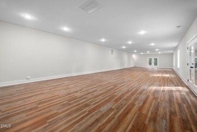 Enjoy one-level living in this beautifully crafted custom ranch on River Golf and Country Club at Lake Royale in North Carolina - for sale on GolfHomes.com, golf home, golf lot