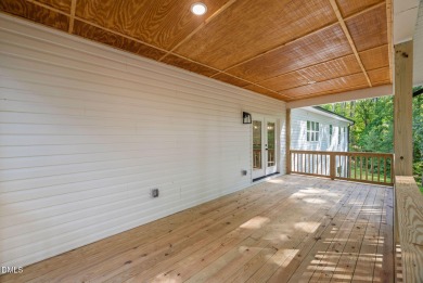 Enjoy one-level living in this beautifully crafted custom ranch on River Golf and Country Club at Lake Royale in North Carolina - for sale on GolfHomes.com, golf home, golf lot