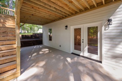 Enjoy one-level living in this beautifully crafted custom ranch on River Golf and Country Club at Lake Royale in North Carolina - for sale on GolfHomes.com, golf home, golf lot