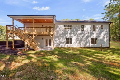Enjoy one-level living in this beautifully crafted custom ranch on River Golf and Country Club at Lake Royale in North Carolina - for sale on GolfHomes.com, golf home, golf lot