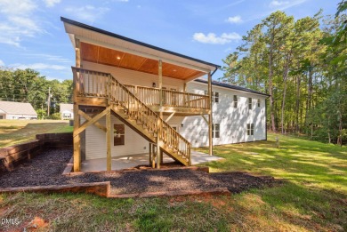 Enjoy one-level living in this beautifully crafted custom ranch on River Golf and Country Club at Lake Royale in North Carolina - for sale on GolfHomes.com, golf home, golf lot