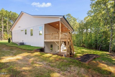 Enjoy one-level living in this beautifully crafted custom ranch on River Golf and Country Club at Lake Royale in North Carolina - for sale on GolfHomes.com, golf home, golf lot