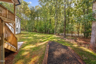 Enjoy one-level living in this beautifully crafted custom ranch on River Golf and Country Club at Lake Royale in North Carolina - for sale on GolfHomes.com, golf home, golf lot