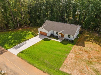 Enjoy one-level living in this beautifully crafted custom ranch on River Golf and Country Club at Lake Royale in North Carolina - for sale on GolfHomes.com, golf home, golf lot