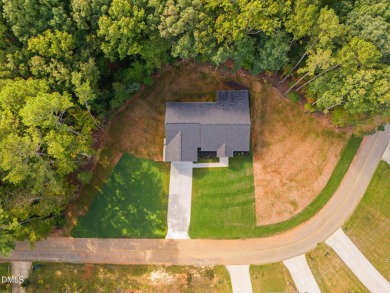 Enjoy one-level living in this beautifully crafted custom ranch on River Golf and Country Club at Lake Royale in North Carolina - for sale on GolfHomes.com, golf home, golf lot
