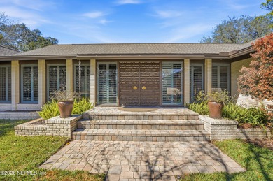 Vaulted ceilings and sunlit interiors define this elegant on The Deerwood Country Club in Florida - for sale on GolfHomes.com, golf home, golf lot