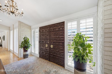 Vaulted ceilings and sunlit interiors define this elegant on The Deerwood Country Club in Florida - for sale on GolfHomes.com, golf home, golf lot