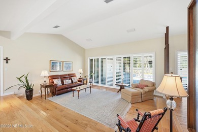 Vaulted ceilings and sunlit interiors define this elegant on The Deerwood Country Club in Florida - for sale on GolfHomes.com, golf home, golf lot