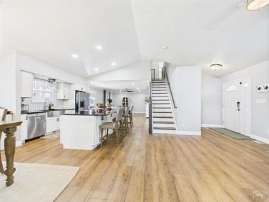 Experience luxury and comfort in this beautiful 2-story home on Desert Hawk At Pueblo West in Colorado - for sale on GolfHomes.com, golf home, golf lot