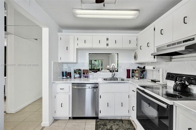 Step into comfort and style with this beautifully updated on Inverrary Country Club in Florida - for sale on GolfHomes.com, golf home, golf lot