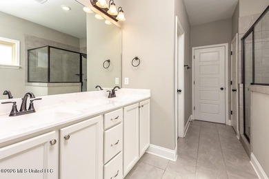 Welcome to this beautifully crafted 4-bedroom, 2-bath home built on Wedgewood Golfers Club in Mississippi - for sale on GolfHomes.com, golf home, golf lot