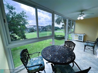 BACK ON MARKET 2nd FLOOR CORNER with WIDE GOLF/LAKE/POOL VIEW on Wynmoor Golf Course in Florida - for sale on GolfHomes.com, golf home, golf lot