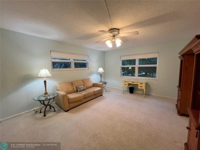 BACK ON MARKET 2nd FLOOR CORNER with WIDE GOLF/LAKE/POOL VIEW on Wynmoor Golf Course in Florida - for sale on GolfHomes.com, golf home, golf lot